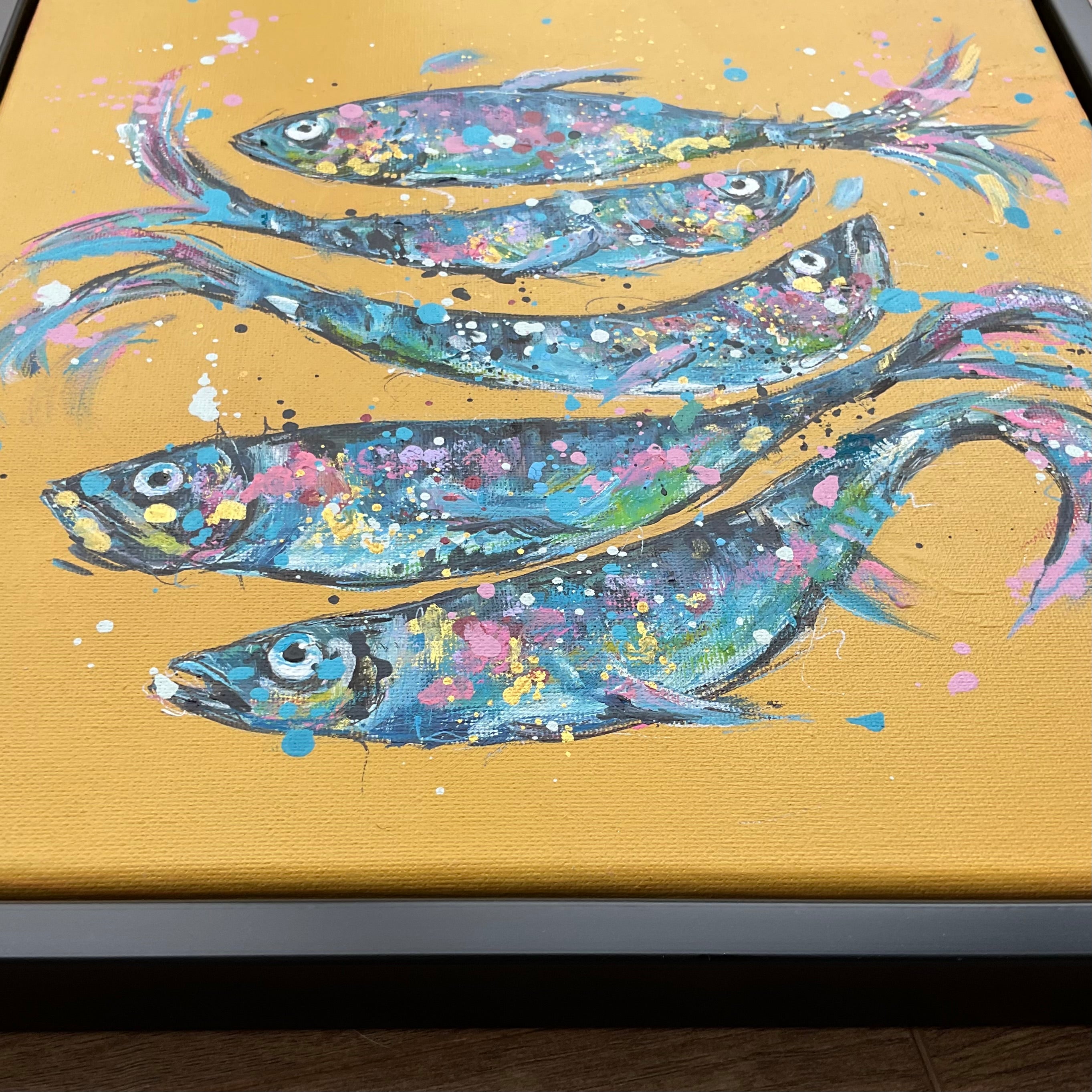 Fish on yellow framed in a black floating frame 30cm