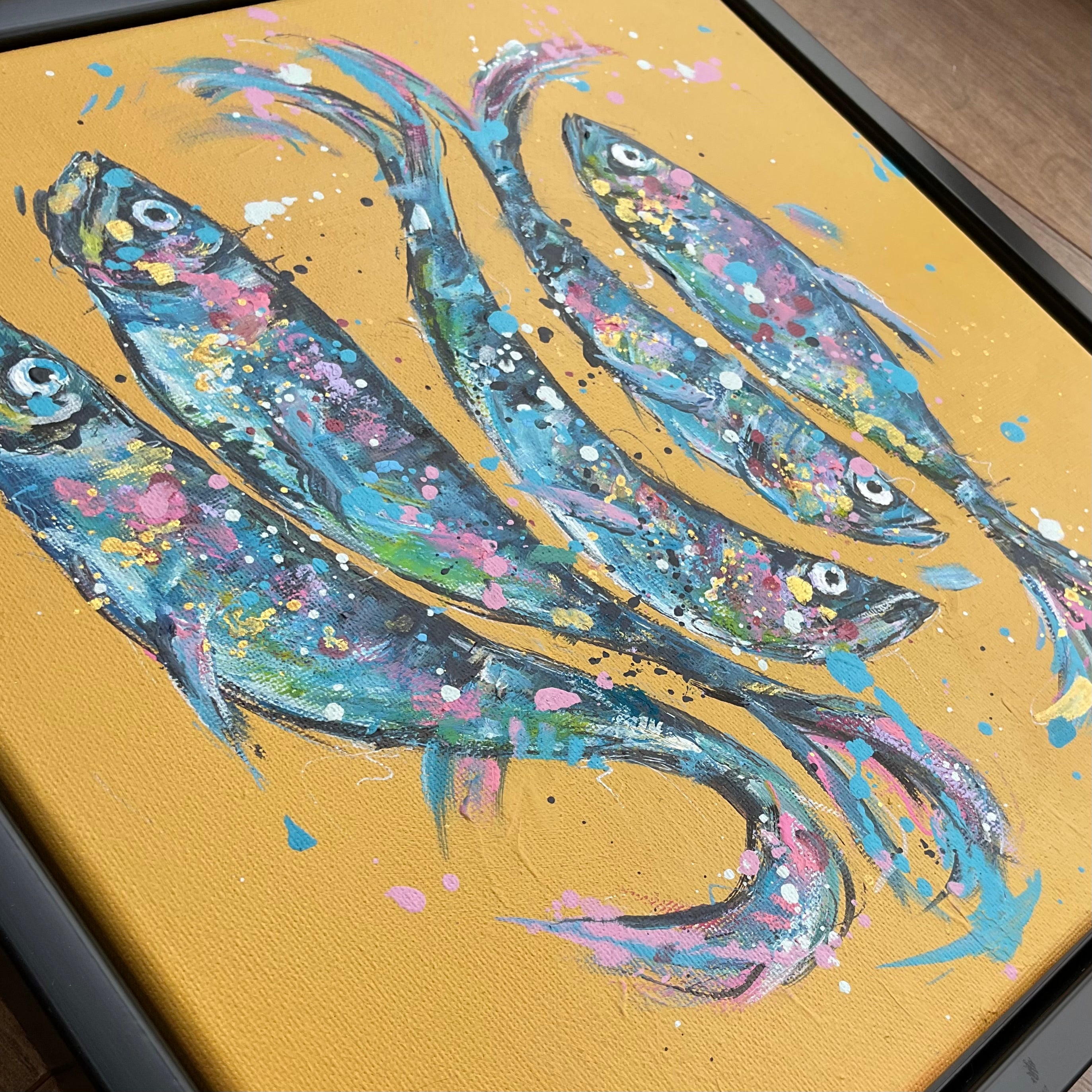 Fish on yellow framed in a black floating frame 30cm