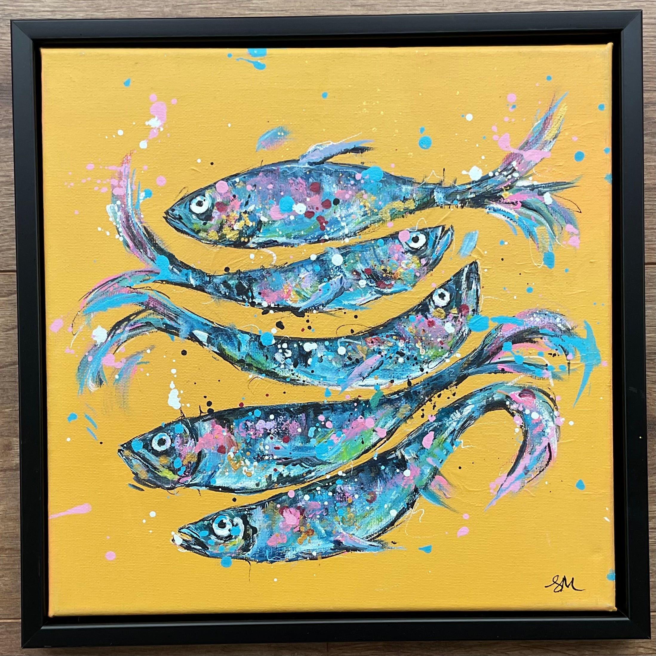 Fish on yellow framed in a black floating frame 30cm